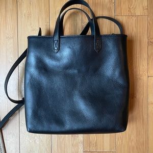 The zip top transport crossbody